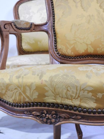 Suite of four molded and carved wood armchairs,...