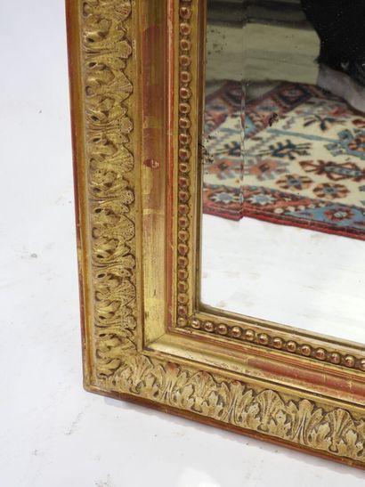Rectangular wood and gilded stucco mirror...