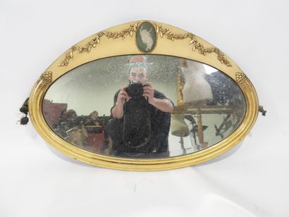 Oval-shaped bevelled mirror in wood and gilded...