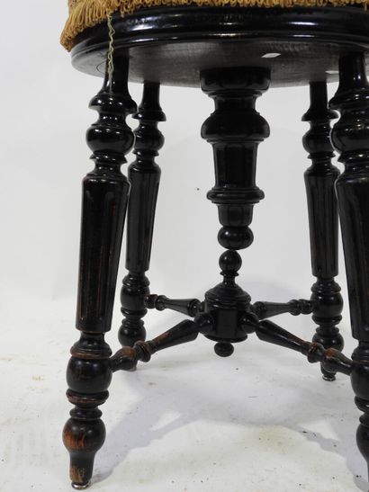 Blackened wood stool, turned, tapered and...