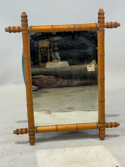 Rectangular bamboo-framed mirror. 
69 x 56...