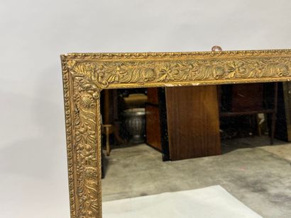 Rectangular wood and gilded stucco mirror...