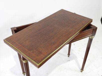 Game table in wood and rosewood veneer, the...