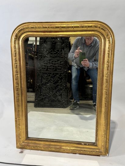 Wood and gilded stucco mirror with rounded...