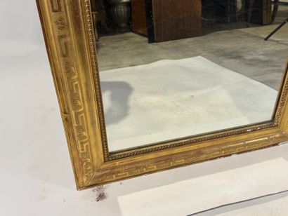 Wood and gilded stucco mirror with rounded...