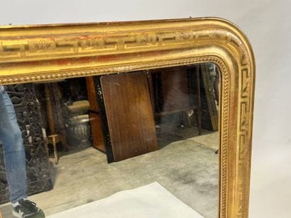 Wood and gilded stucco mirror with rounded...