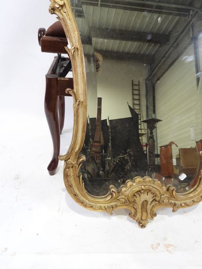 Wood and gilded stucco mirror with Rocaille...