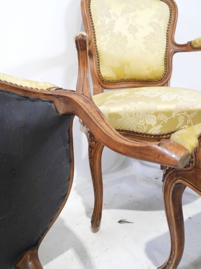 Suite of four molded and carved wood armchairs,...