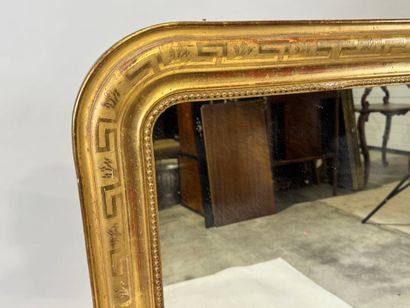 Wood and gilded stucco mirror with rounded...