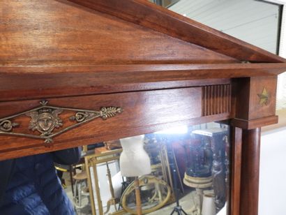 Exotic wood mirror with half-columns topped...