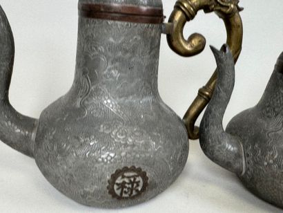 ASIA, 20th century.
Pewter and gilt bronze...