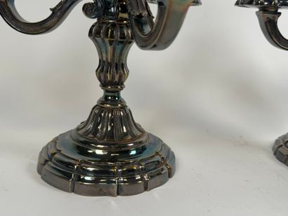 Pair of silver-plated three-light metal torches.
H....