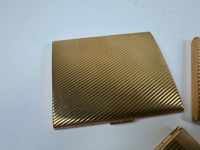 Three gilt metal cigarette cases.
10.5 x...