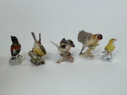 Collection of five polychrome porcelain subjects,...