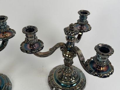 Pair of silver-plated three-light metal torches.
H....