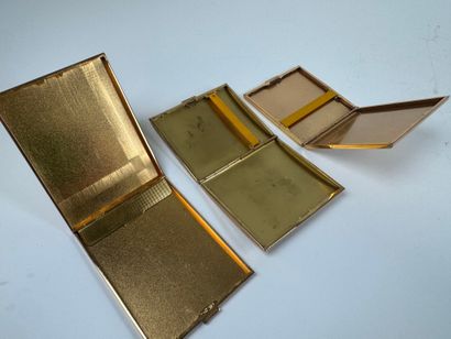 Three gilt metal cigarette cases.
10.5 x...
