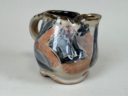 Enameled stoneware pitcher with polychrome...