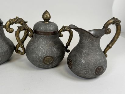 ASIA, 20th century.
Pewter and gilt bronze...