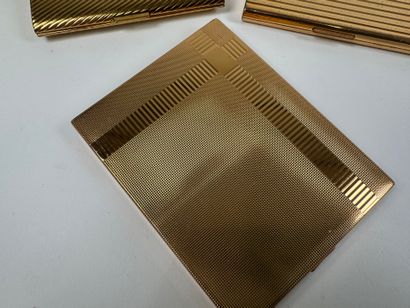 Three gilt metal cigarette cases.
10.5 x...