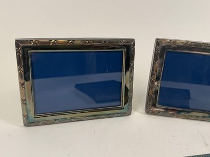 Two silver-plated picture frames decorated...