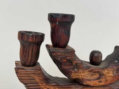 Four-arm candlestick in wood. 
Brutalist...