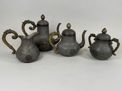 ASIA, 20th century.
Pewter and gilt bronze...