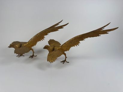 Pair of gilded and chased metal figures of...