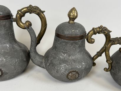 ASIA, 20th century.
Pewter and gilt bronze...