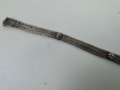 Probably a foreign silver belt decorated...