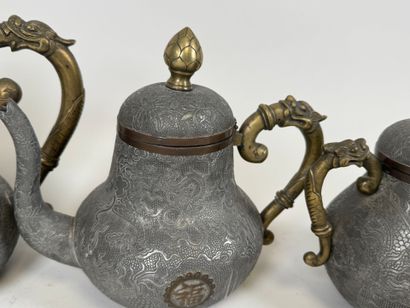 ASIA, 20th century.
Pewter and gilt bronze...
