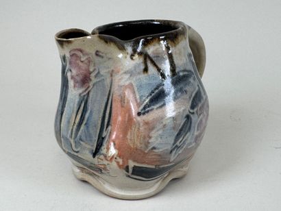 Enameled stoneware pitcher with polychrome...