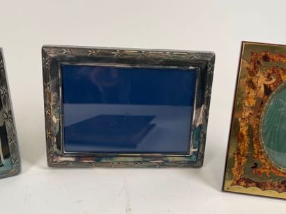 Two silver-plated picture frames decorated...