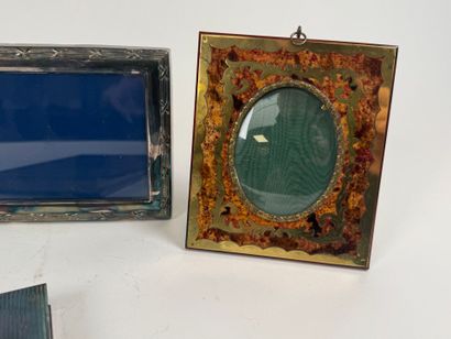 Two silver-plated picture frames decorated...