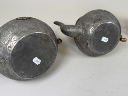 ASIA, 20th century.
Pewter and gilt bronze...
