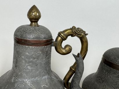ASIA, 20th century.
Pewter and gilt bronze...