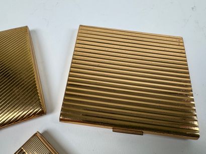 Three gilt metal cigarette cases.
10.5 x...