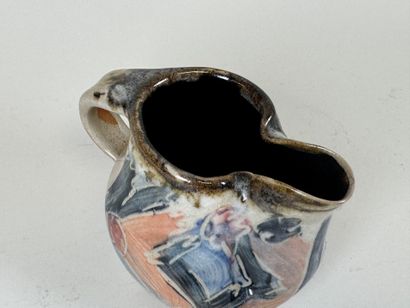 Enameled stoneware pitcher with polychrome...