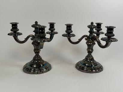 Pair of silver-plated three-light metal torches.
H....