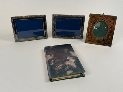 Two silver-plated picture frames decorated...
