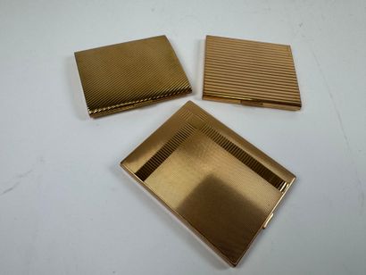 Three gilt metal cigarette cases.
10.5 x...