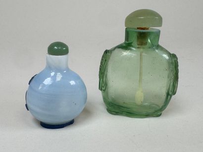 ASIA, 20th century.
Two glass snuffboxes,...