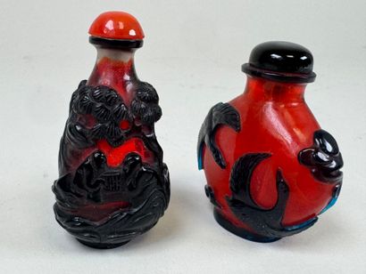 ASIA, 20th century.
Two glass snuffboxes...
