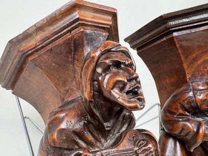 Two carved and patinated wood wall brackets...