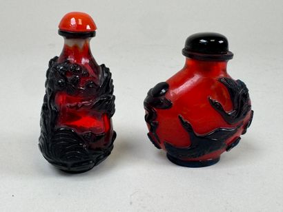 ASIA, 20th century.
Two glass snuffboxes...