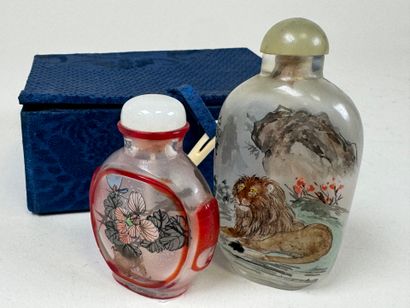 ASIA, 20th century.
Two glass snuffboxes...