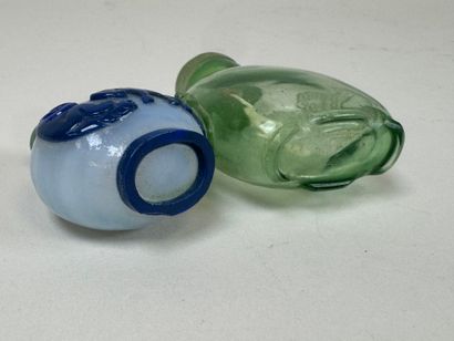 ASIA, 20th century.
Two glass snuffboxes,...
