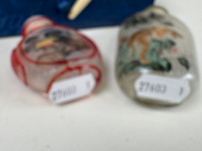 ASIA, 20th century.
Two glass snuffboxes...
