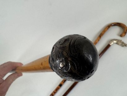 Set of three wood and bamboo canes, one with...