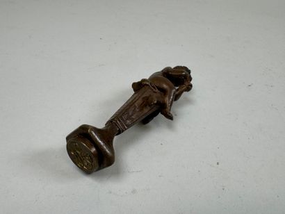 Bronze seal featuring a cherub mounted on...