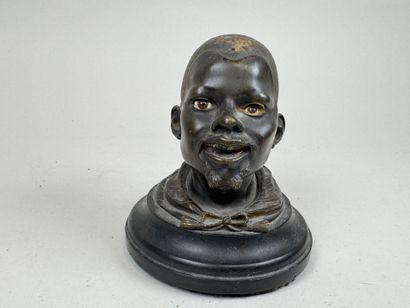 Bronze desk inkwell decorated with a man's...